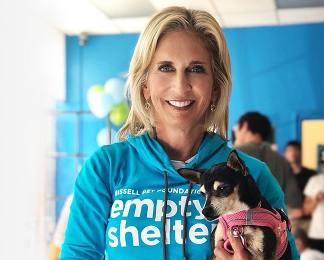 Cathy Bissell holding a rescue dog